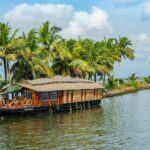 Traditional houseboat cruising through the backwaters of Alappuzha, Kerala.