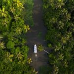 Scenic beauty of Vembanad Kayal in Kottayam, Kerala, with tranquil backwaters and lush surroundings.