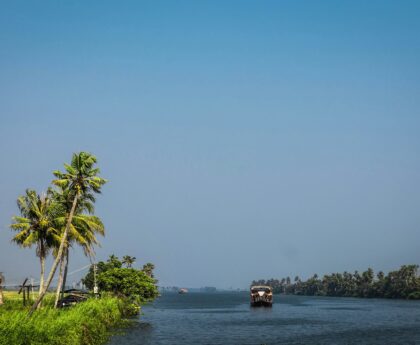 Scenic waterways of Alappuzha, Kerala, lined with lush greenery and traditional boats.