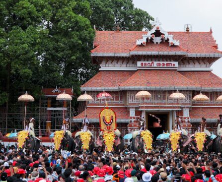 Colorful Thrissur Pooram festival with caparisoned elephants, traditional umbrellas, and vibrant cultural displays in Kerala.